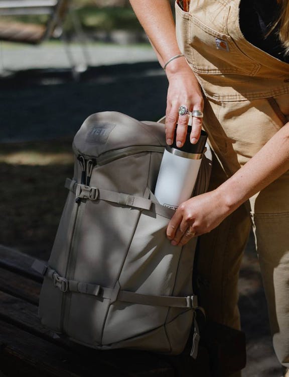 White Travel Bottle in Ranchero Backpack Side Pocket