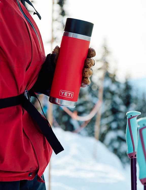 red bottle in hand
