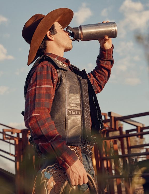 cowboy drinking water from a chug bottle rambler 769ml