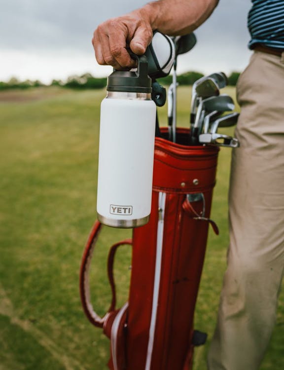 rambler 1L chug bottle in white on golf course