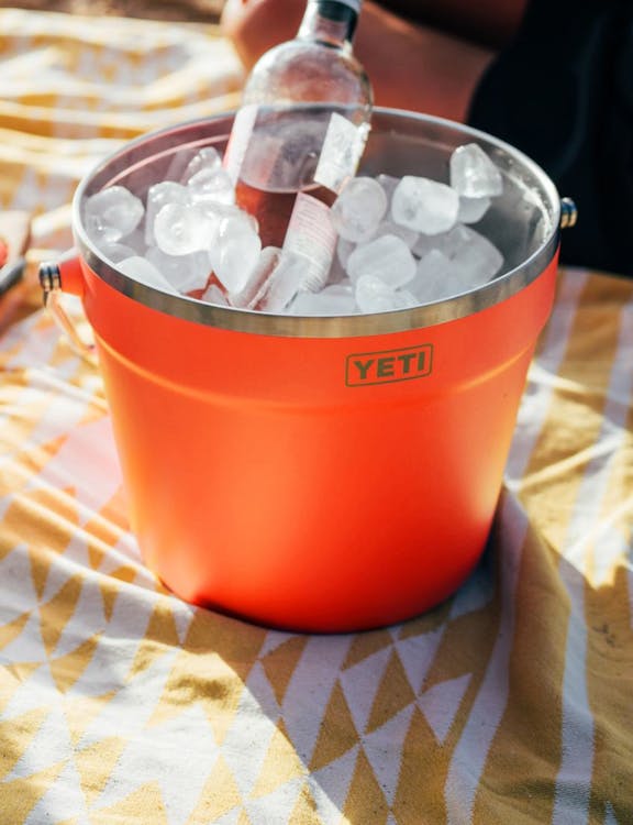 White Pitcher pouring into stackable cup.